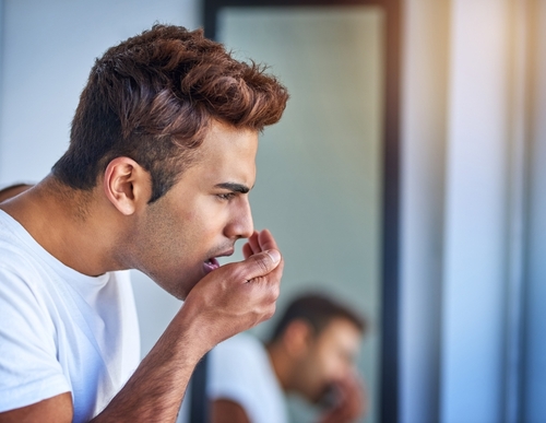 man with bad breath