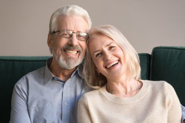 older woman and man laughing