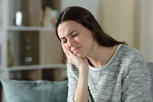 woman with tooth pain