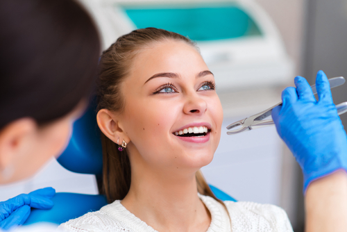 woman getting a tooth extraction