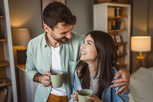 couple drinking out of mugs